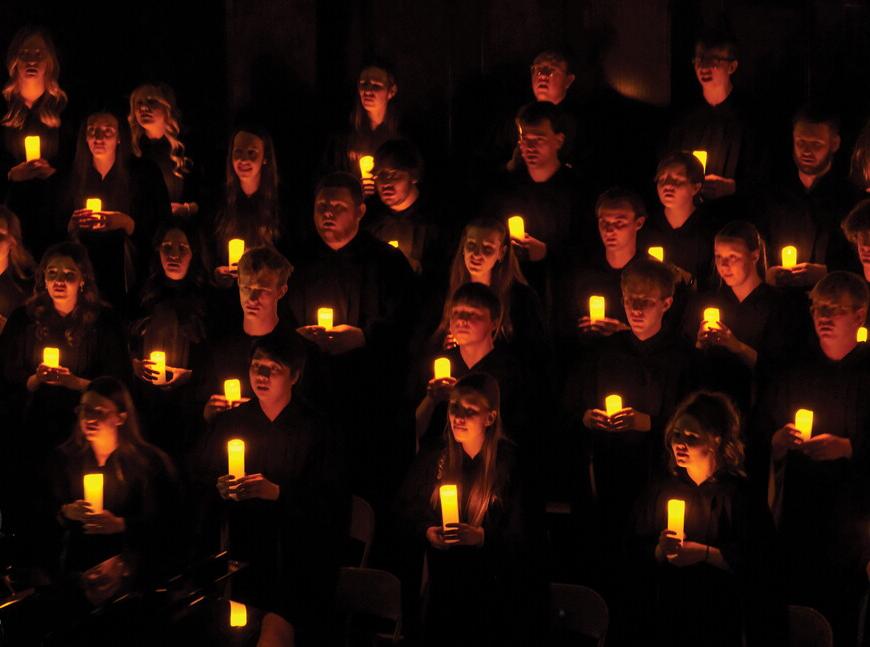 NWU Choir with candles during Christmas with Wesleyan. 